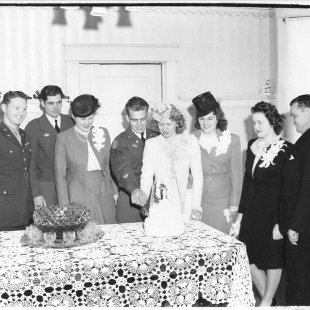 Lola and Al cut the cake